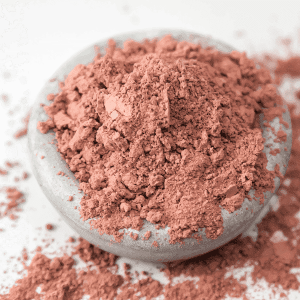 Rose Clay ingredient photograph showing pink cosmetic clay powder