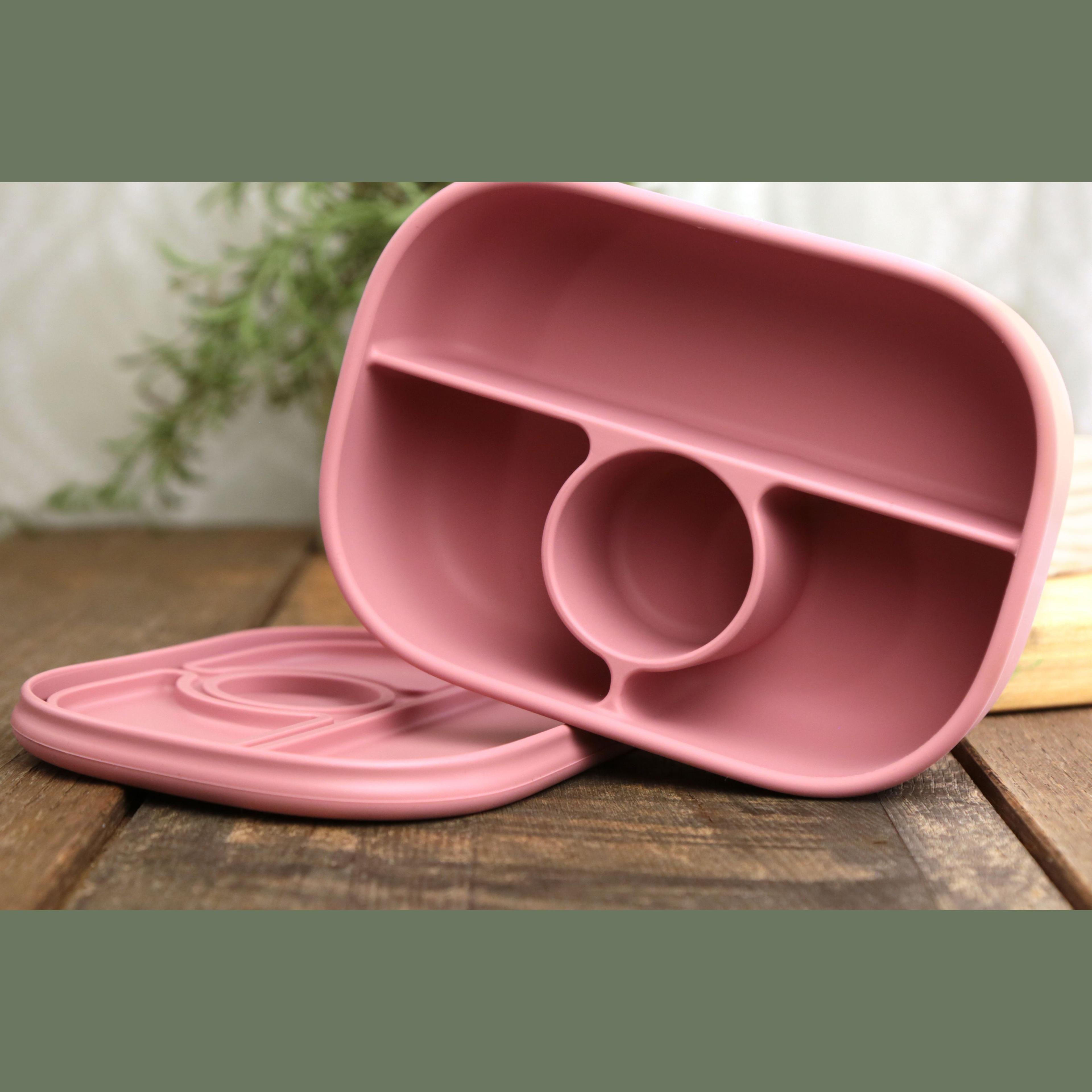 Calla and Friends silicone bento box in dusty rose pink color showing empty compartments with lid removed on wooden surface