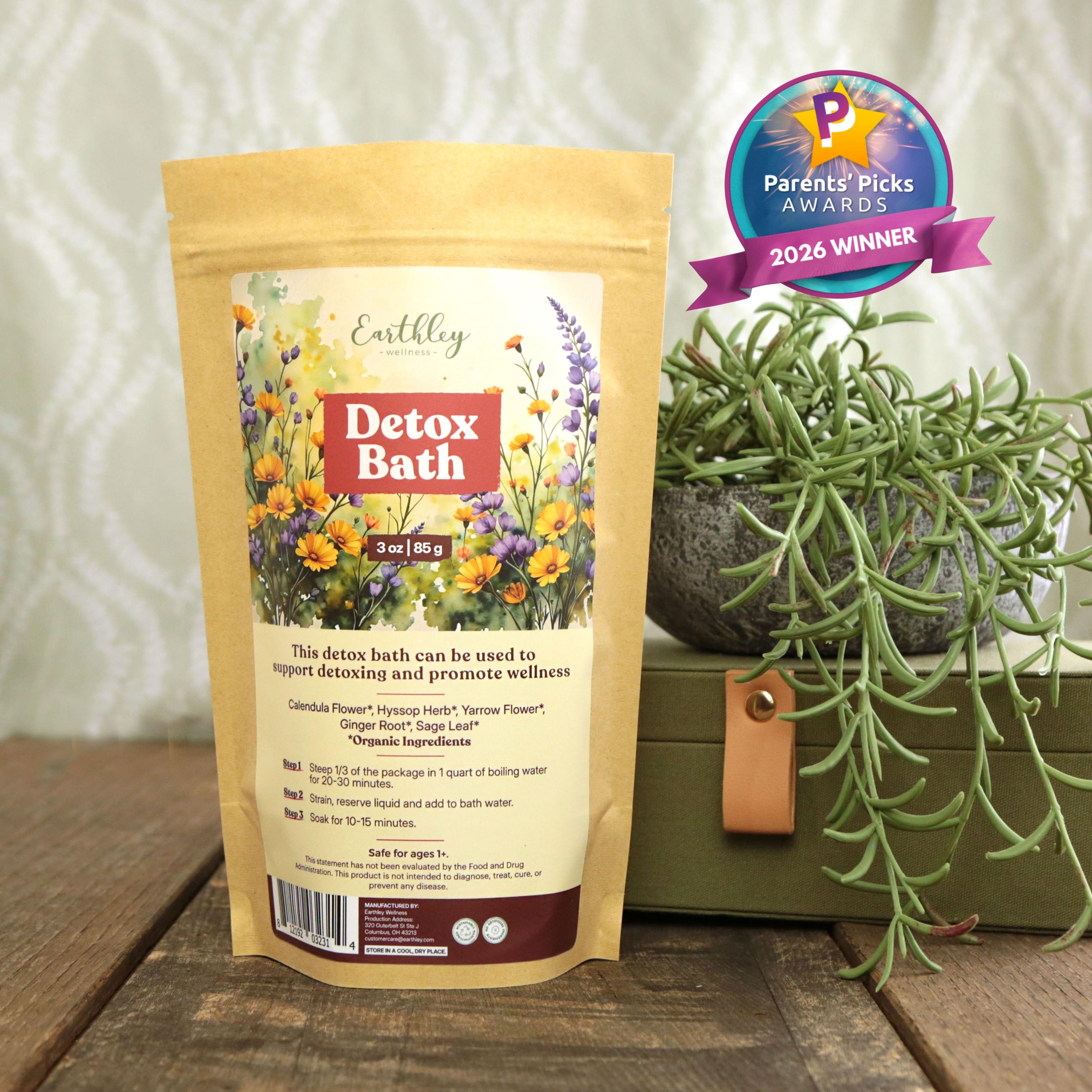 Earthley Detox Bath herbal blend package with Parents' Picks 2026 Winner award badge, displayed with succulent plants