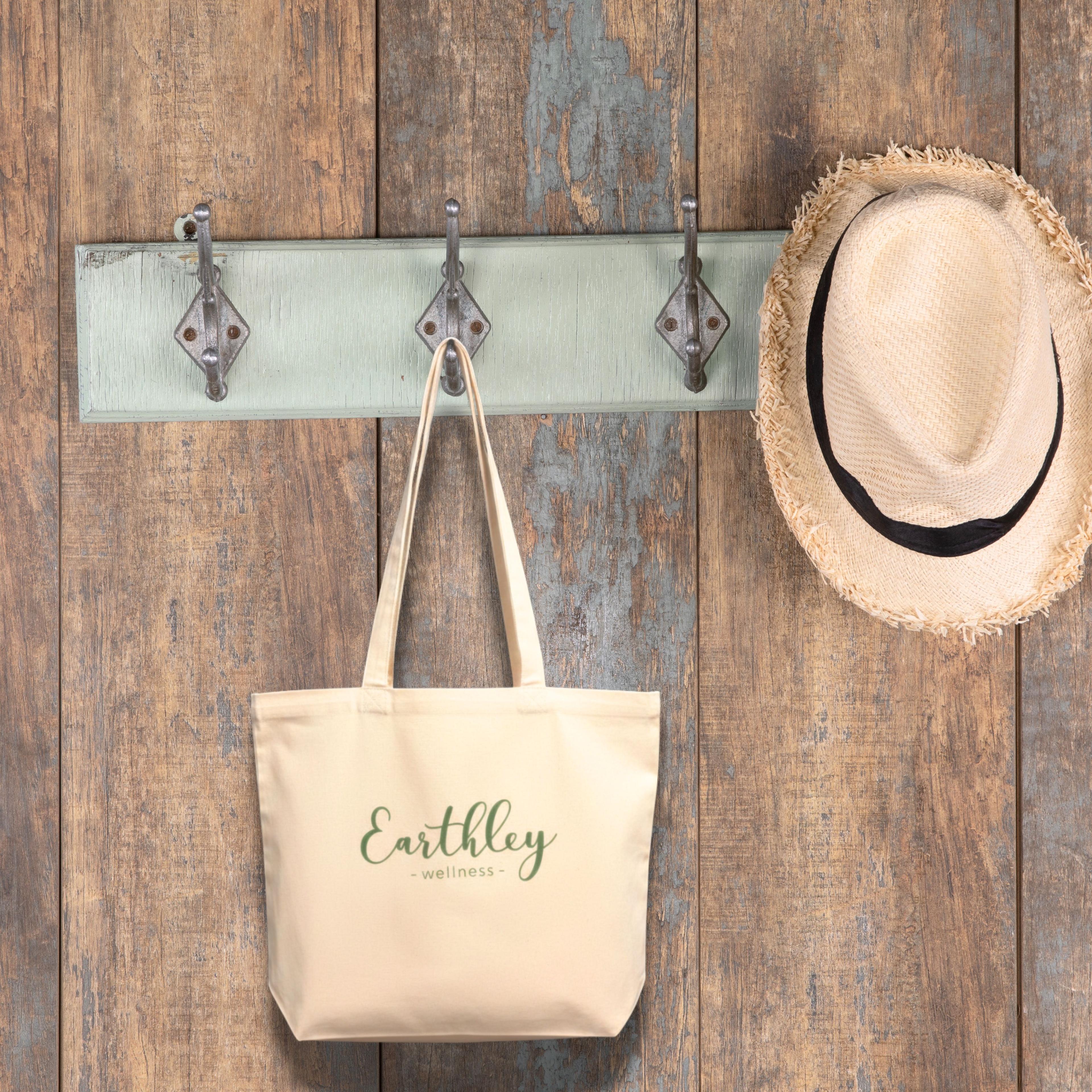 Earthley Tote Bag natural canvas bag. Has earthley green logo on one side and green saying "We have an Herb for That"
