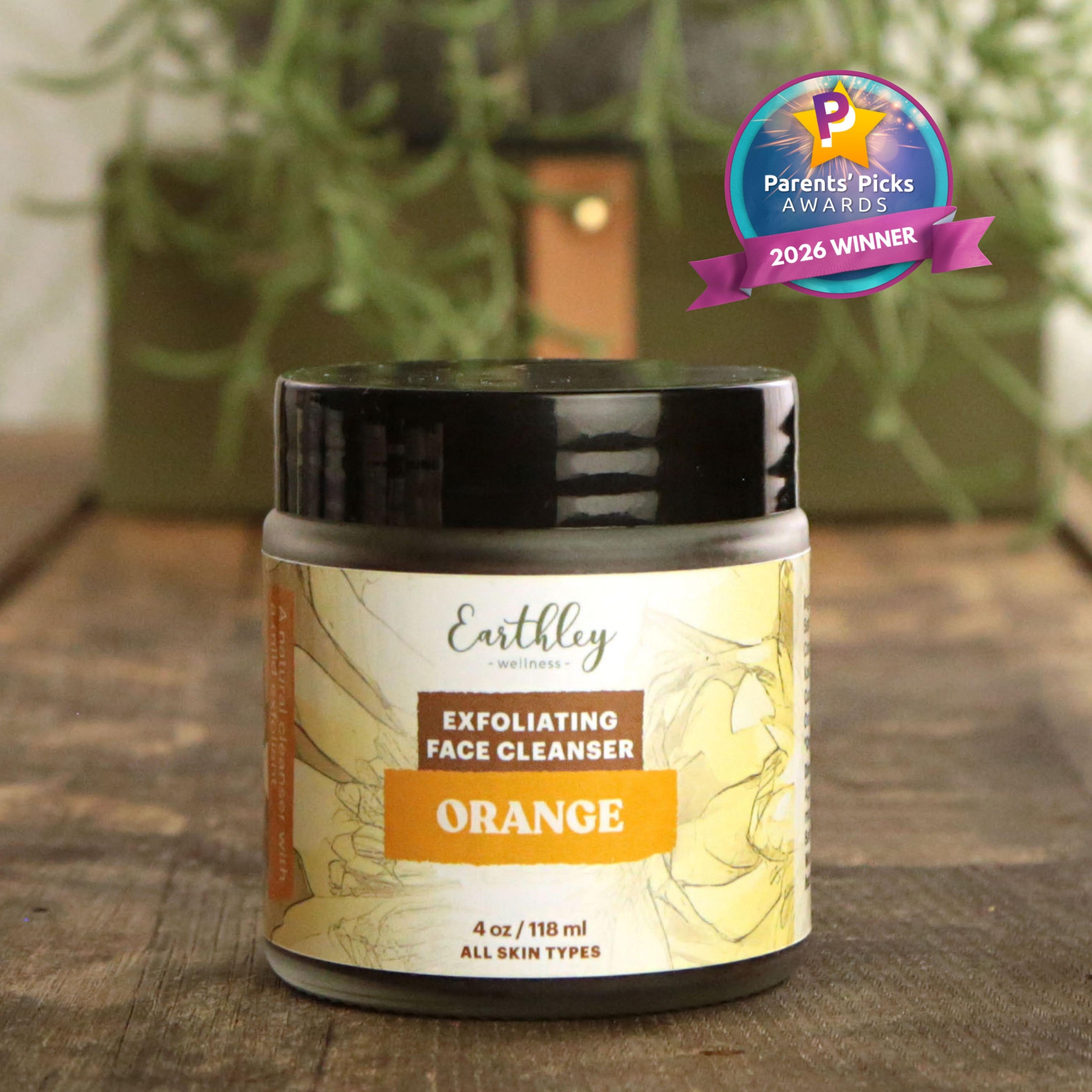 Earthley Wellness Orange Exfoliating Face Cleanser jar with Parents' Picks Awards 2026 Winner badge on wooden surface