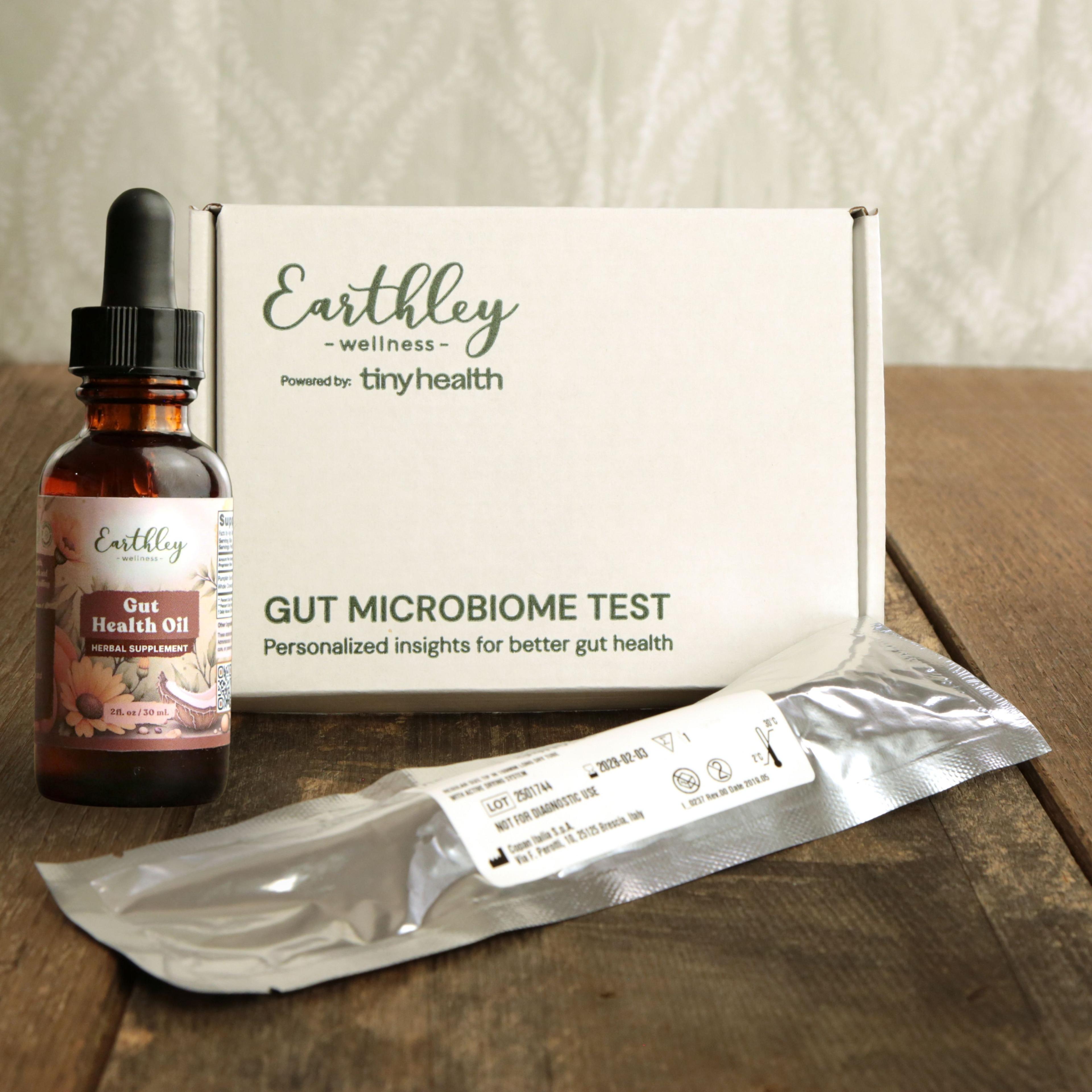Earthley Gut Health Oil tincture beside Gut Microbiome Test kit and sample swab packet