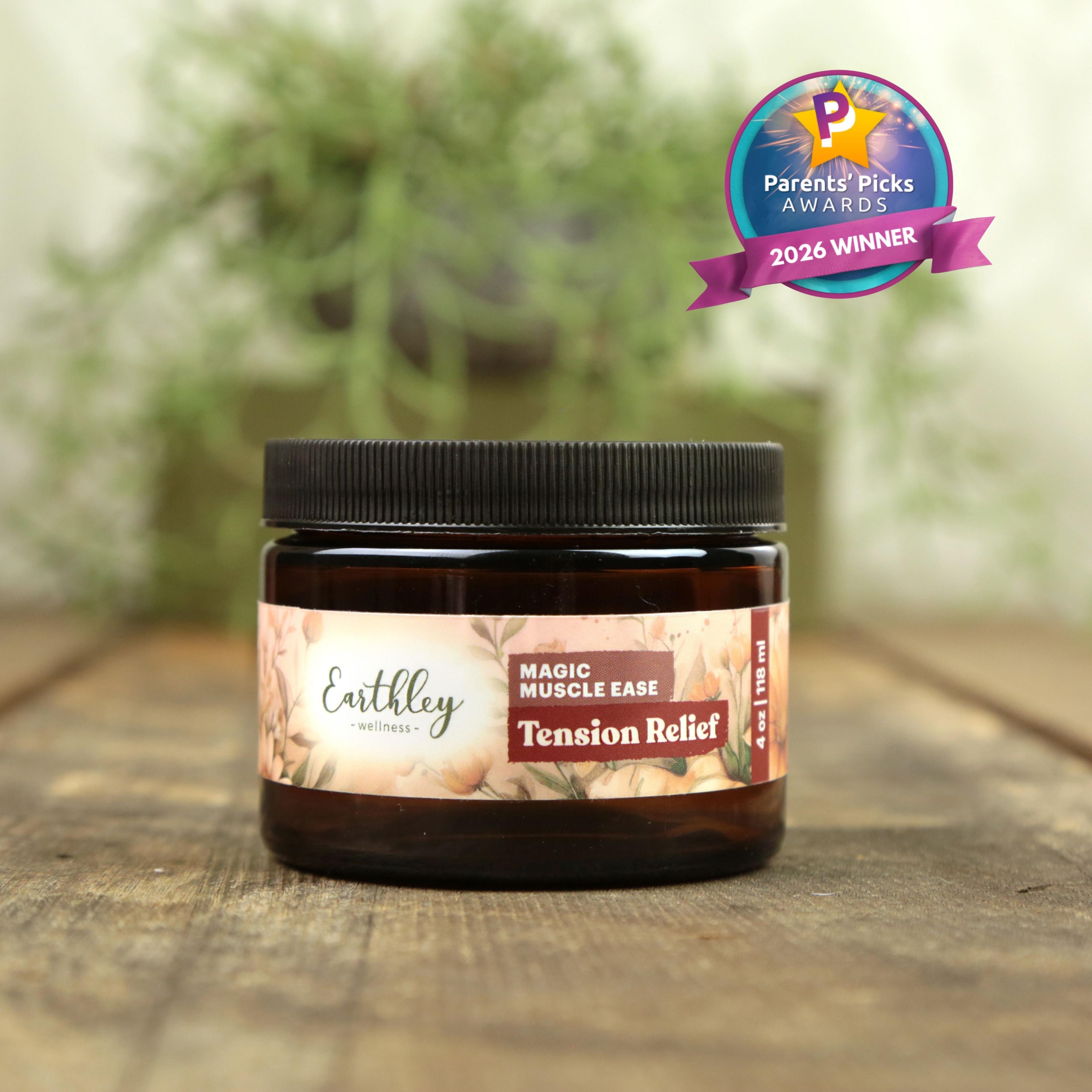 Earthley Magic Muscle Ease Tension Relief salve jar with Parents' Picks Awards 2026 Winner badge on wooden surface