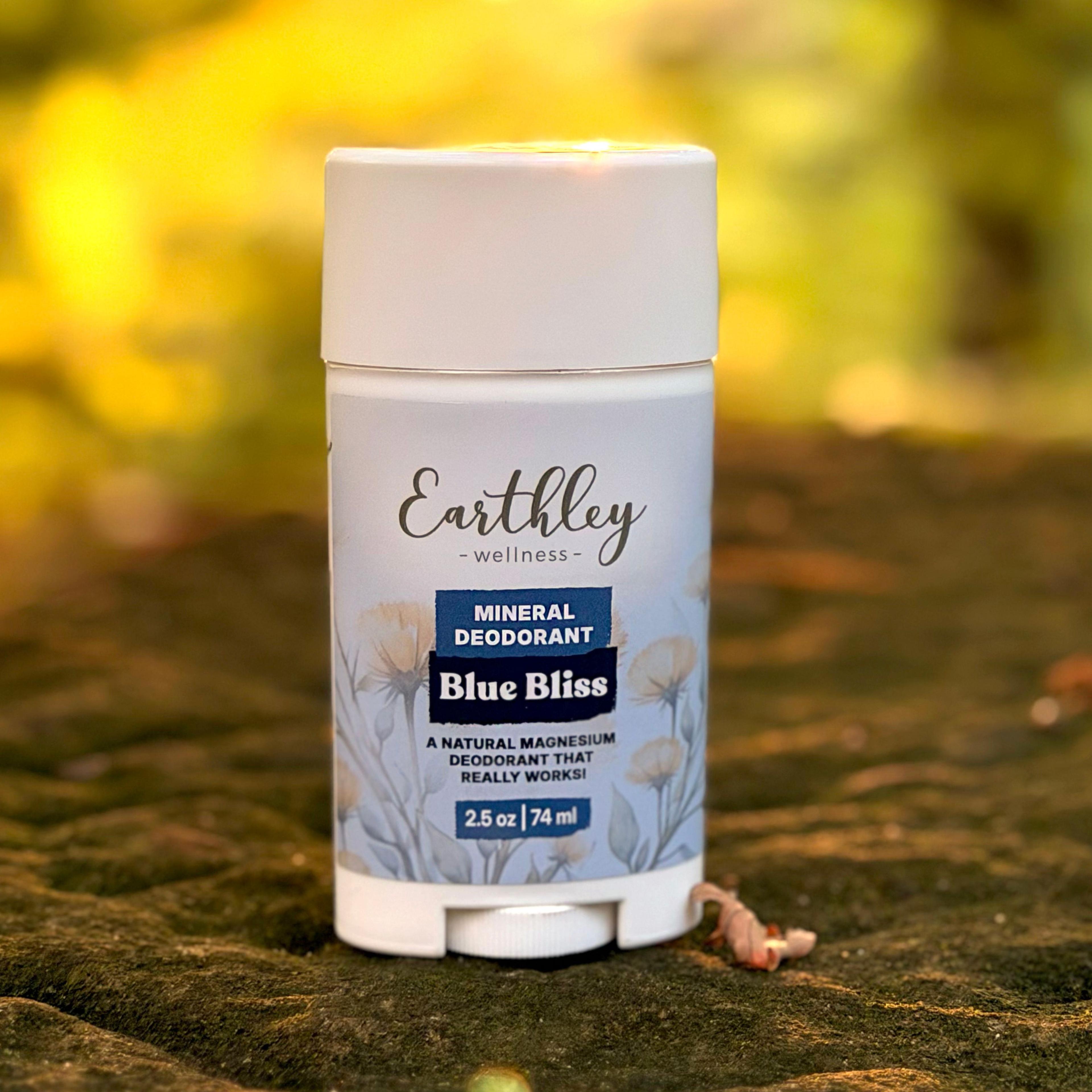 Earthley Wellness Blue Bliss Mineral Deodorant stick, 2.5 oz, on mossy rock outdoors