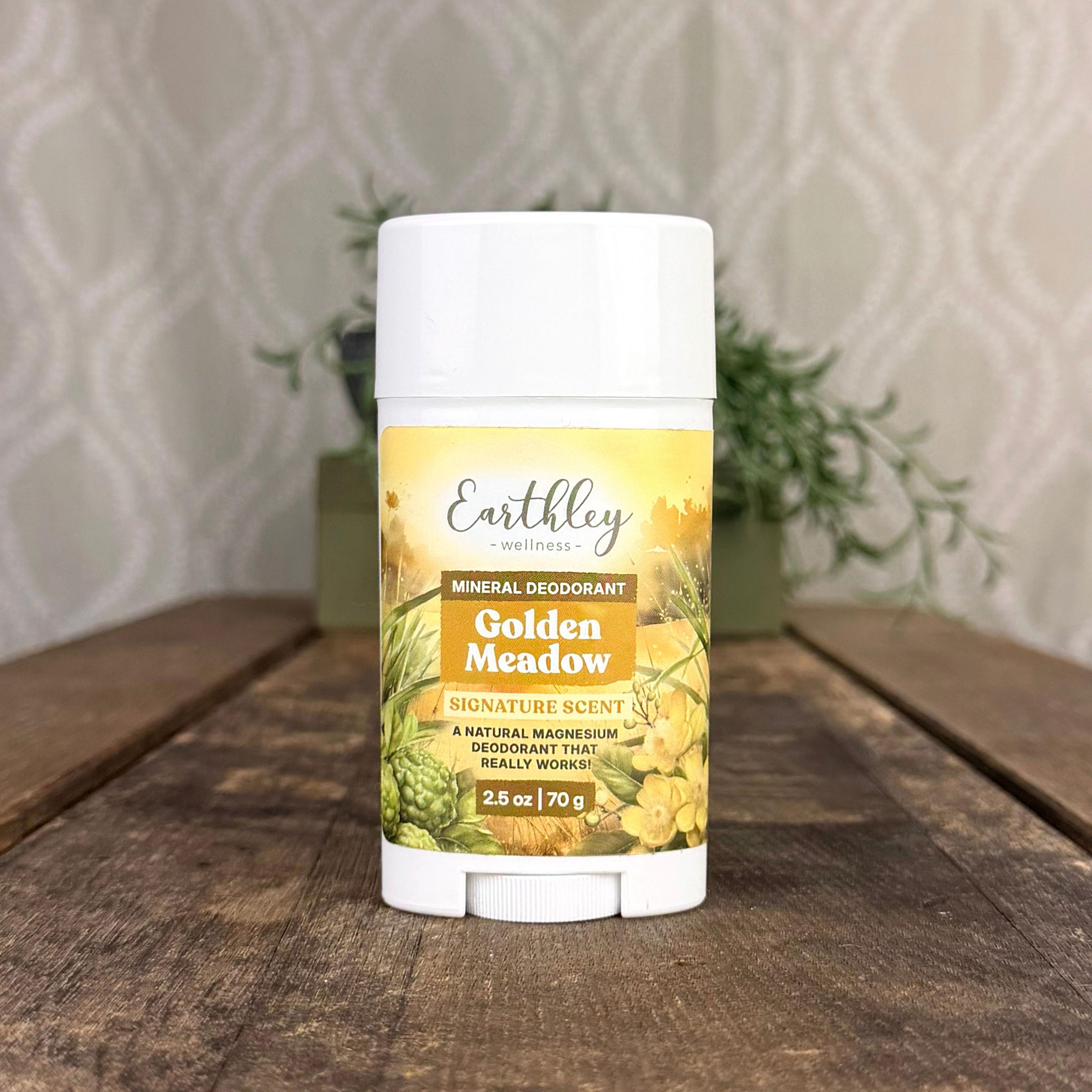 Earthley Wellness Golden Meadow Mineral Deodorant stick, 2.5 oz, on wood surface