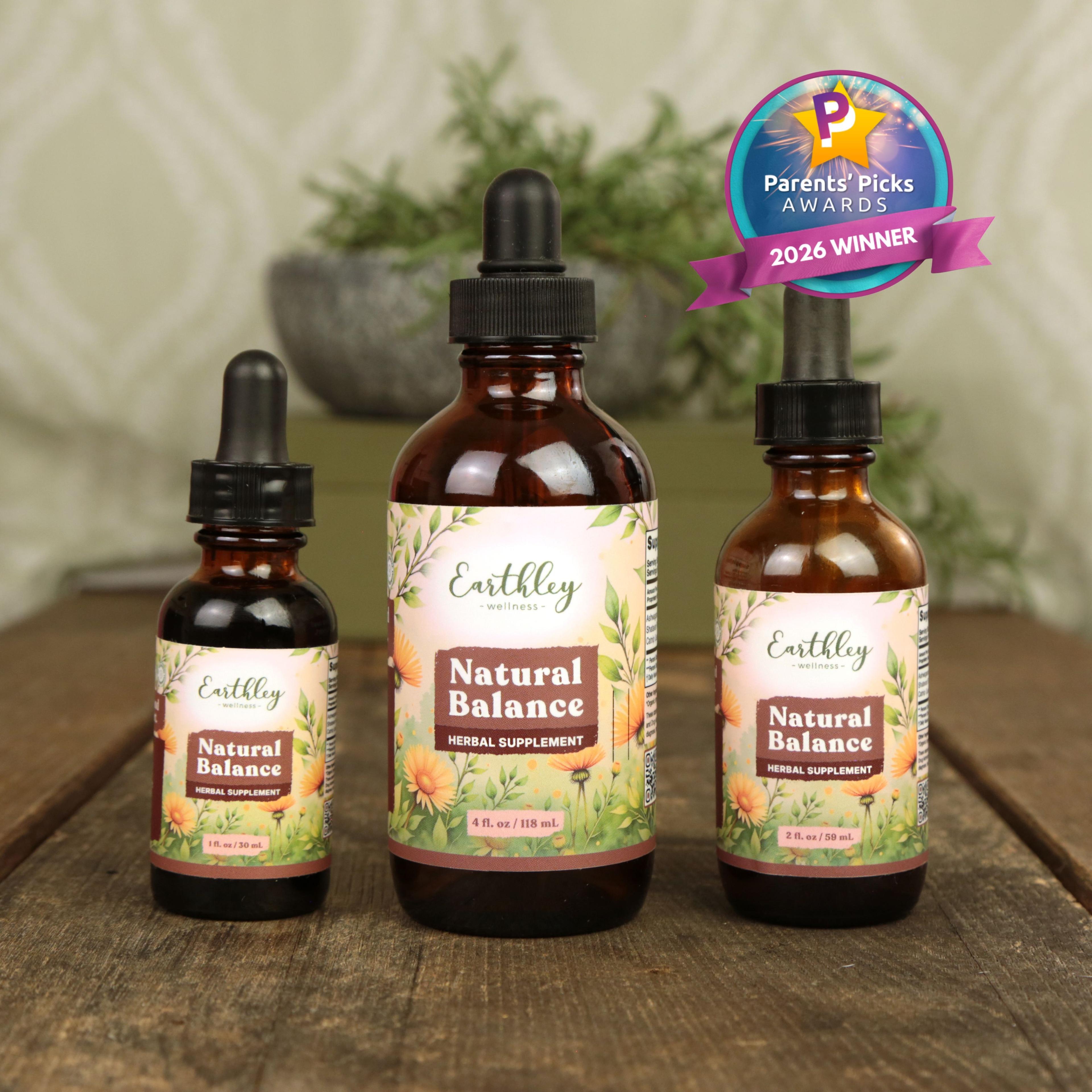 Three amber glass bottles of Earthley Natural Balance herbal supplement tinctures in 1oz, 4oz, and 2oz sizes with Parents' Picks 2026 Winner award ...