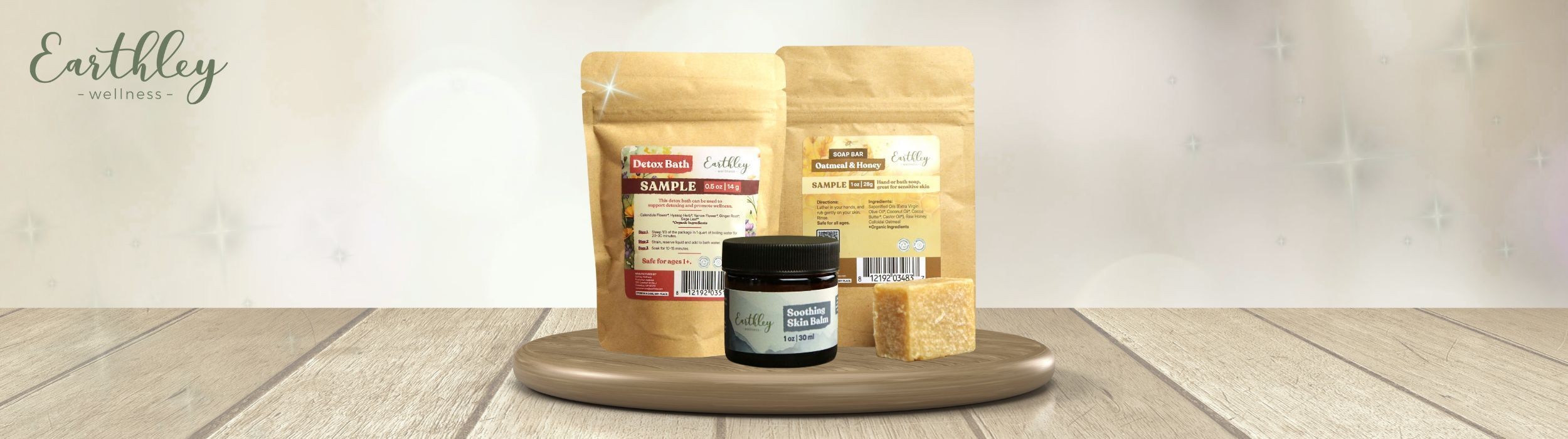 Earthley newsletter landing page header showing product display with Detox Bath sample, Oatmeal and Honey soap bar sample, and Soothing Skin Balm jar on wooden tray with kraft paper pouches in background