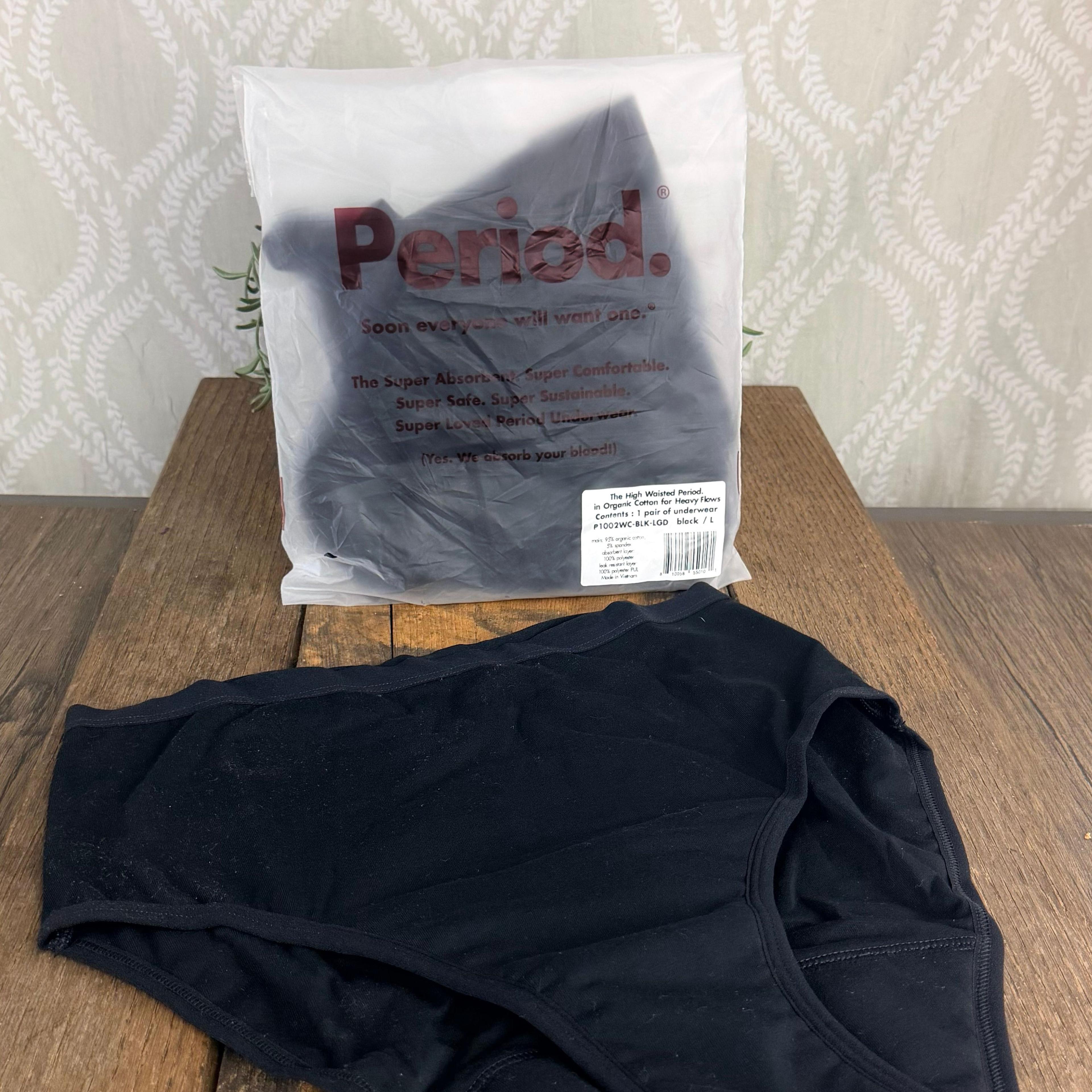 Black high-waisted Period. brand organic cotton period underwear beside clear packaging bag