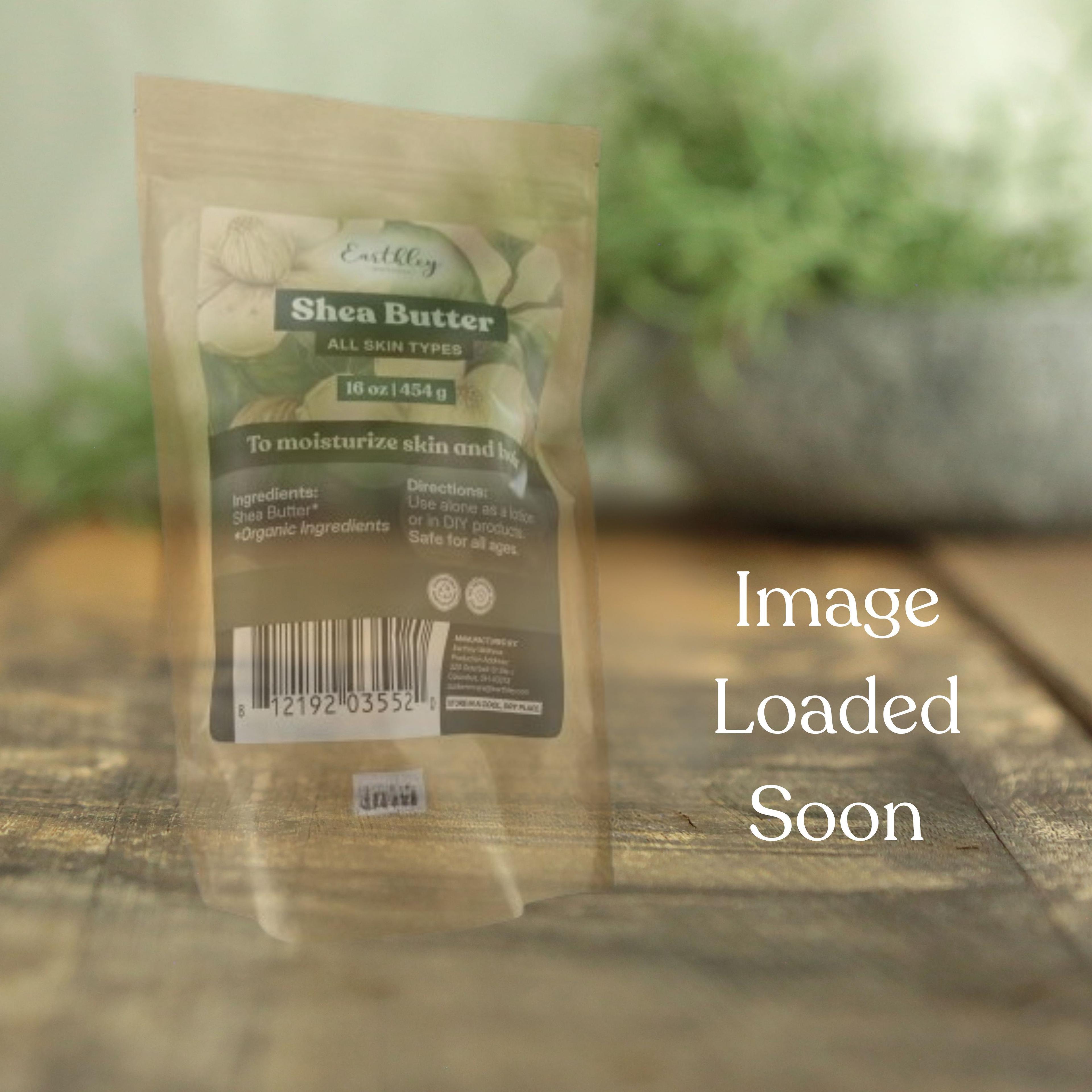 Earthley Shea Butter package in kraft pouch on wooden surface with blurred greenery background