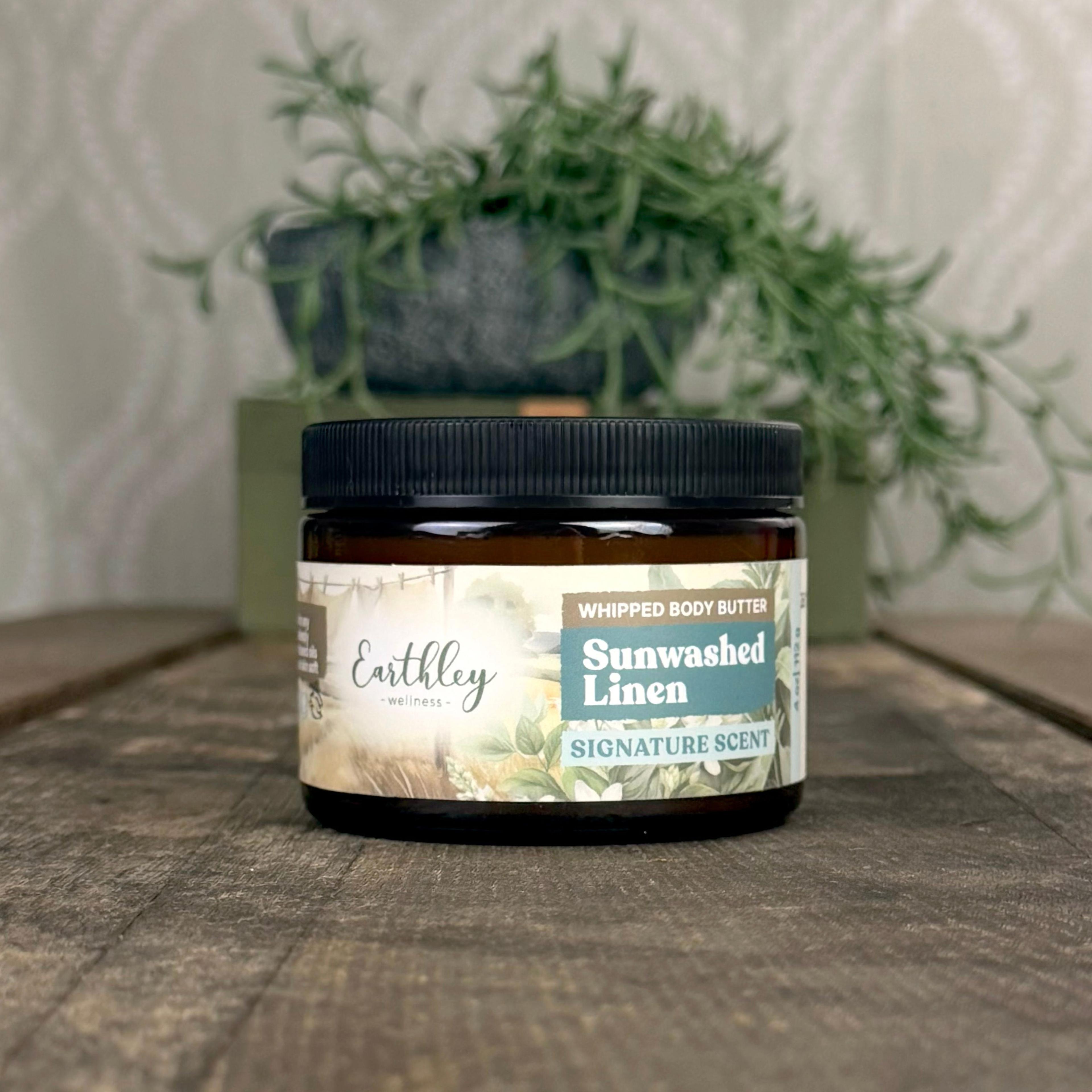 Earthley Wellness Sunwashed Linen Whipped Body Butter in amber jar with black lid