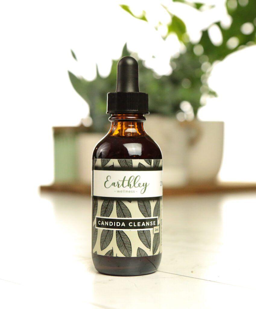 Candida Cleanse herbal extract in amber dropper bottle with black and white leaf label