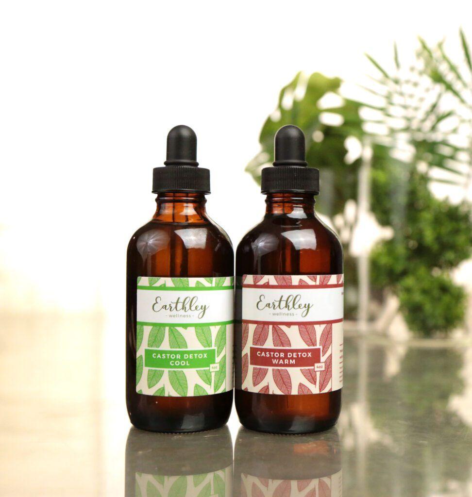 Castor Detox Cool and Warm formulas in amber dropper bottles with green and red labels