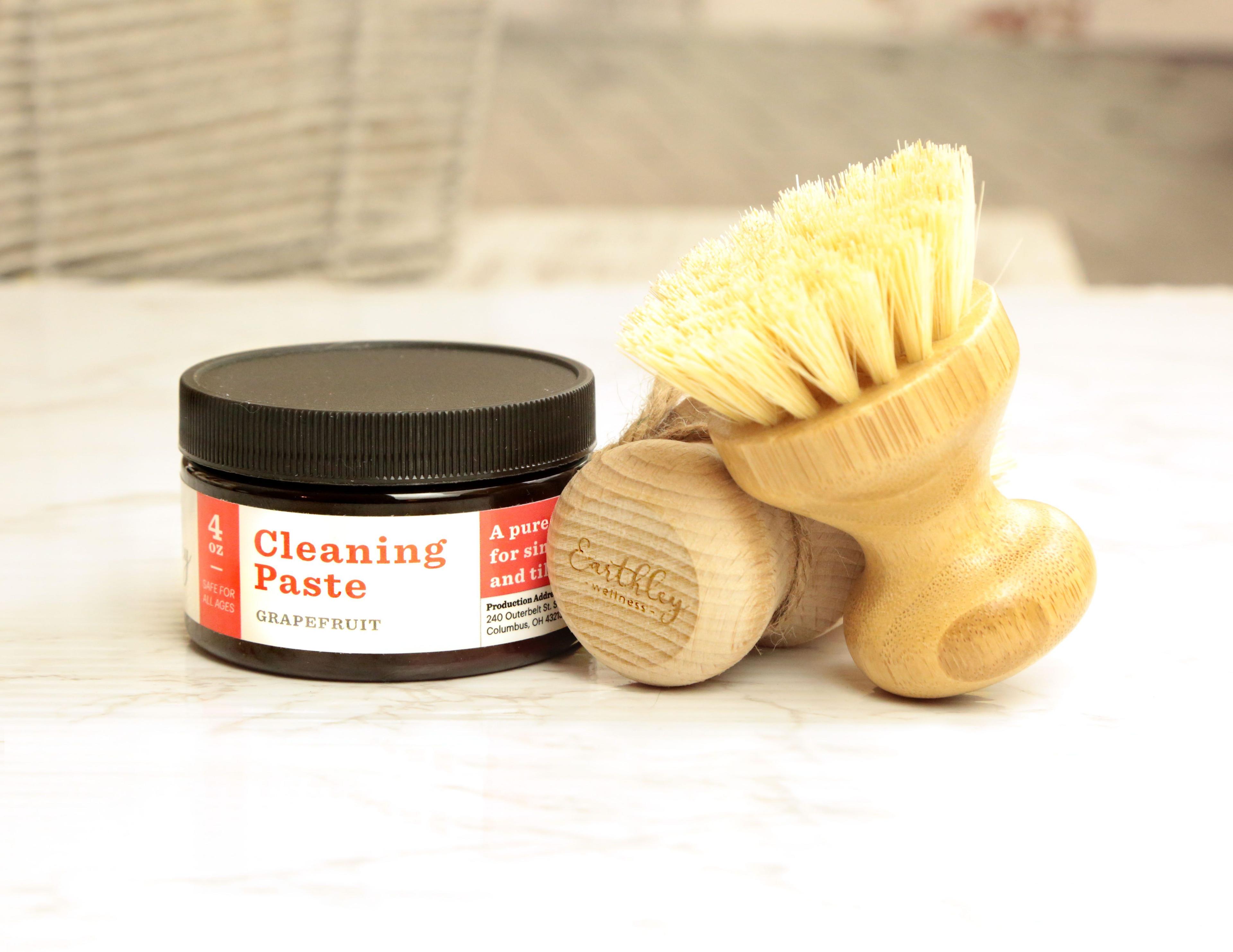 Earthley Cleaning Paste amber jar showing white natural cleaning paste for household surfaces