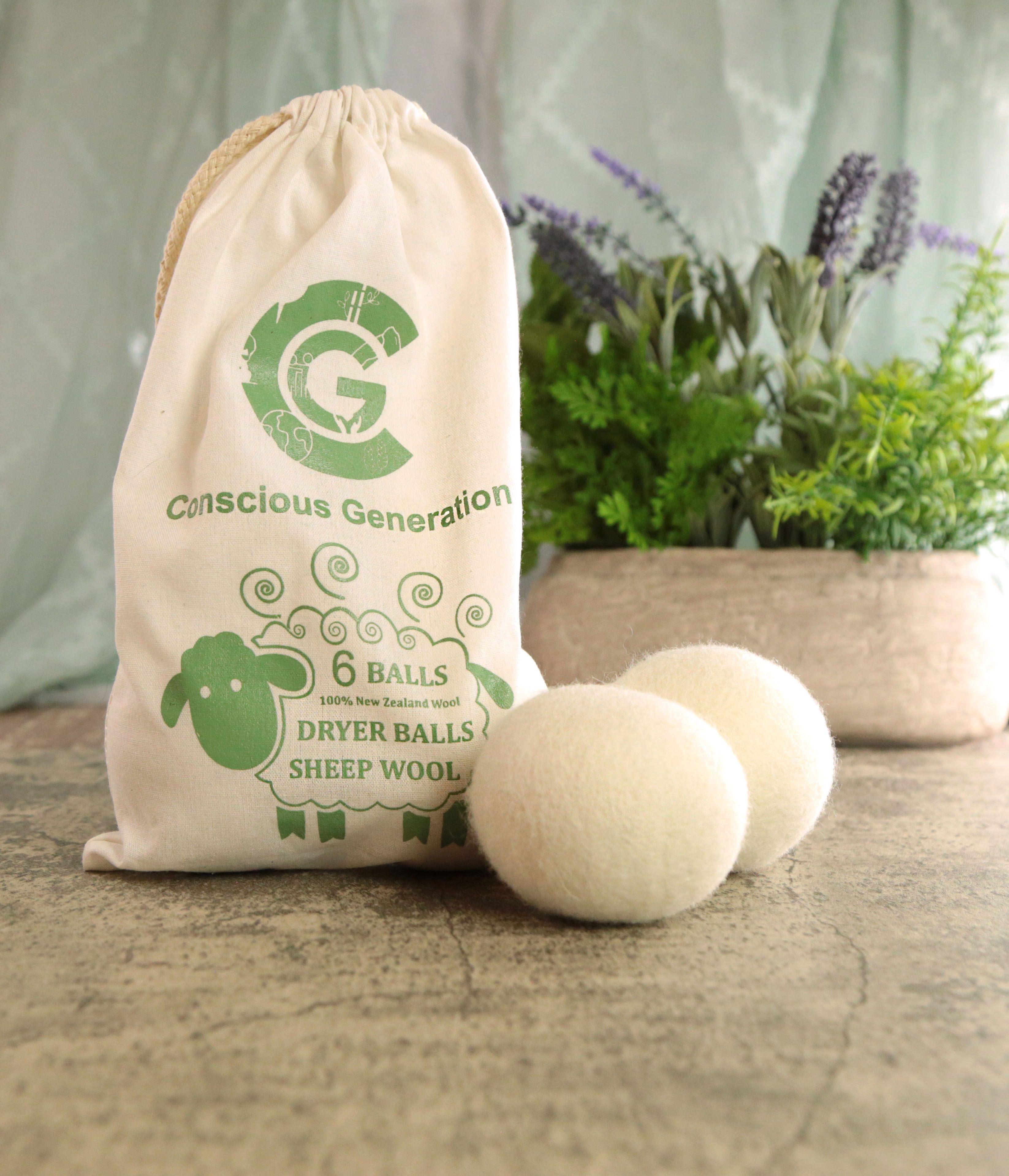 Earthley Wool Dryer Balls single natural white felted ball close-up showing texture on marble surface with greenery