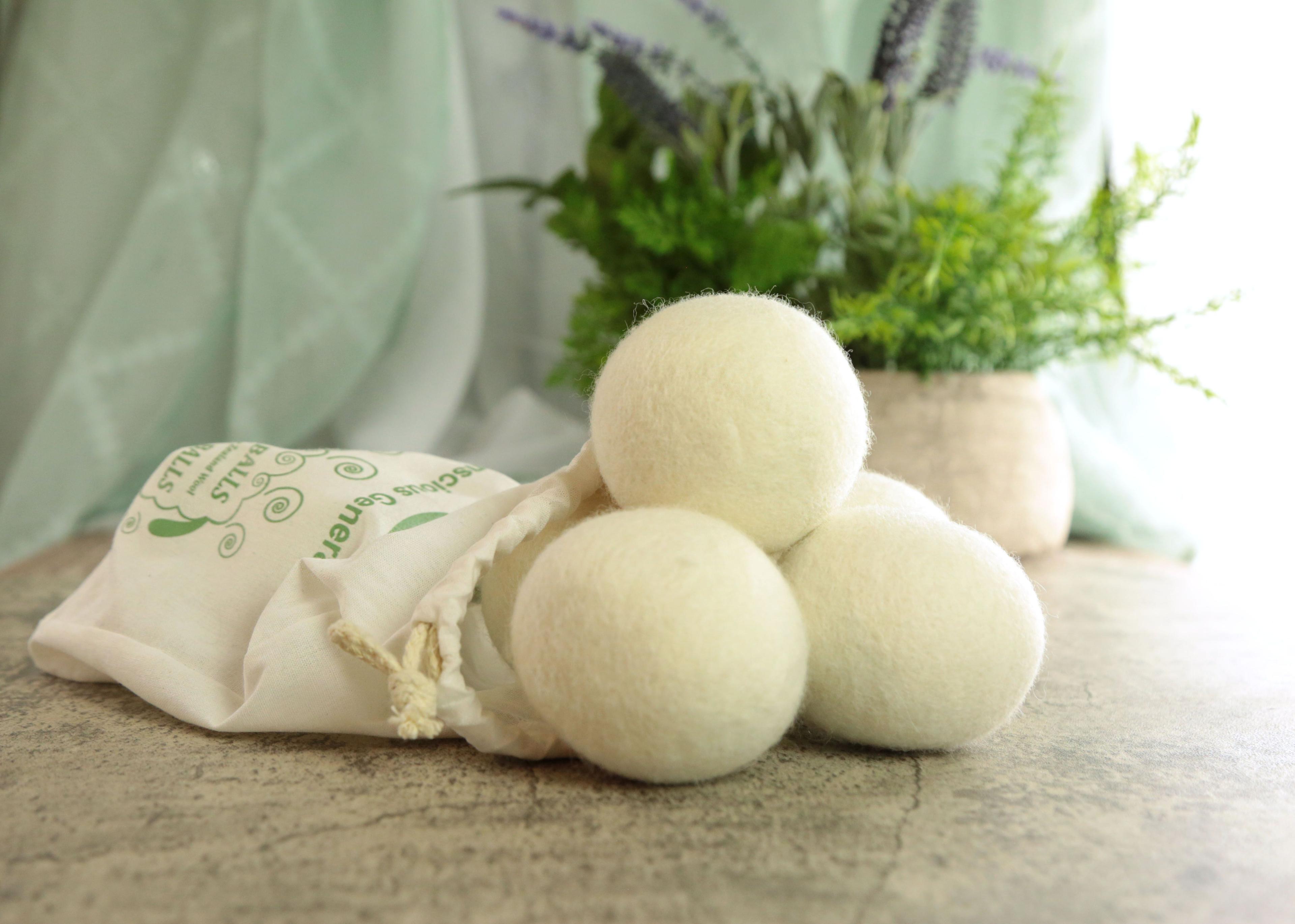 Earthley Wool Dryer Ball Set product photo showing three natural white felted balls on clean white background