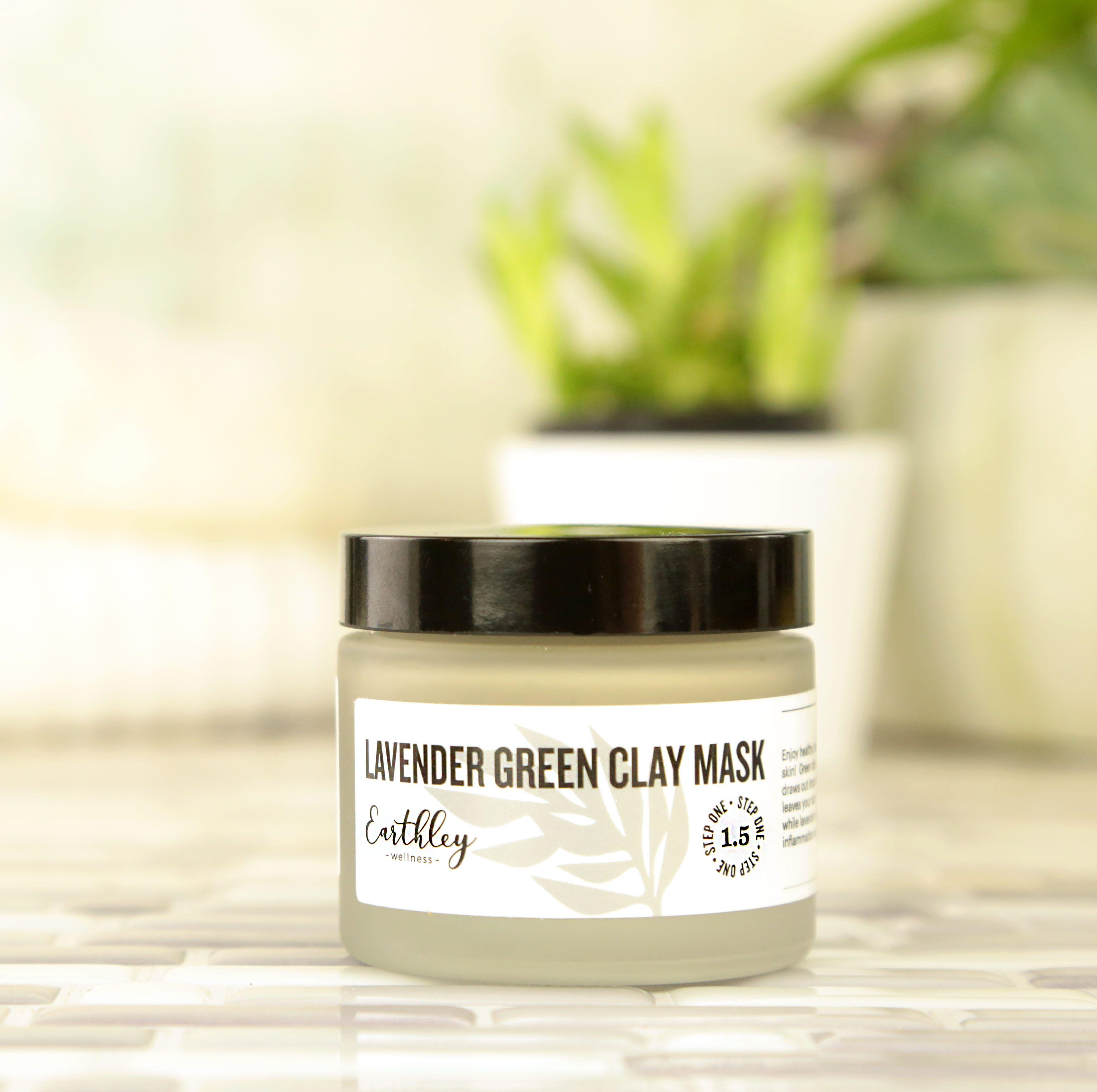 Lavender Green Clay Mask jar with gray-green cream showing Step One label and plants