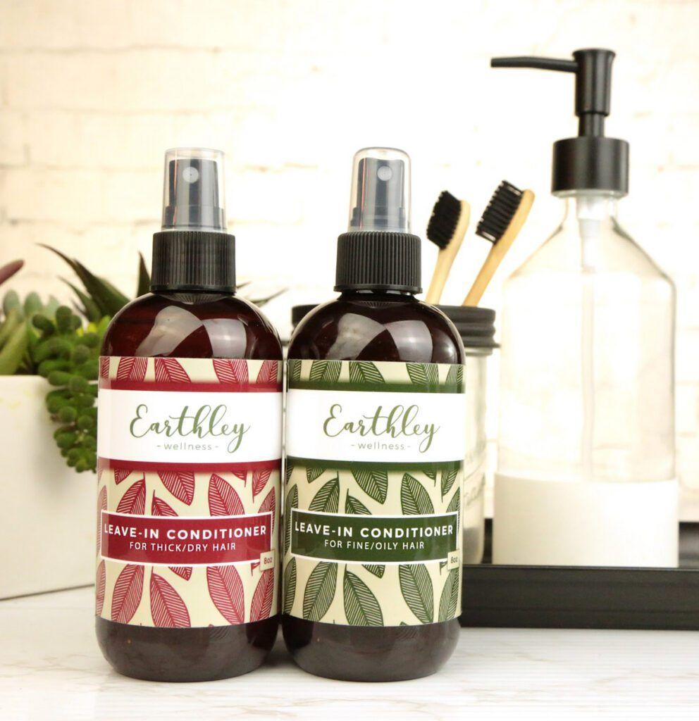Leave-In Conditioner duo in amber spray bottles featuring Thick/Dry Hair with burgundy label and Fine/Oily Hair with green label
