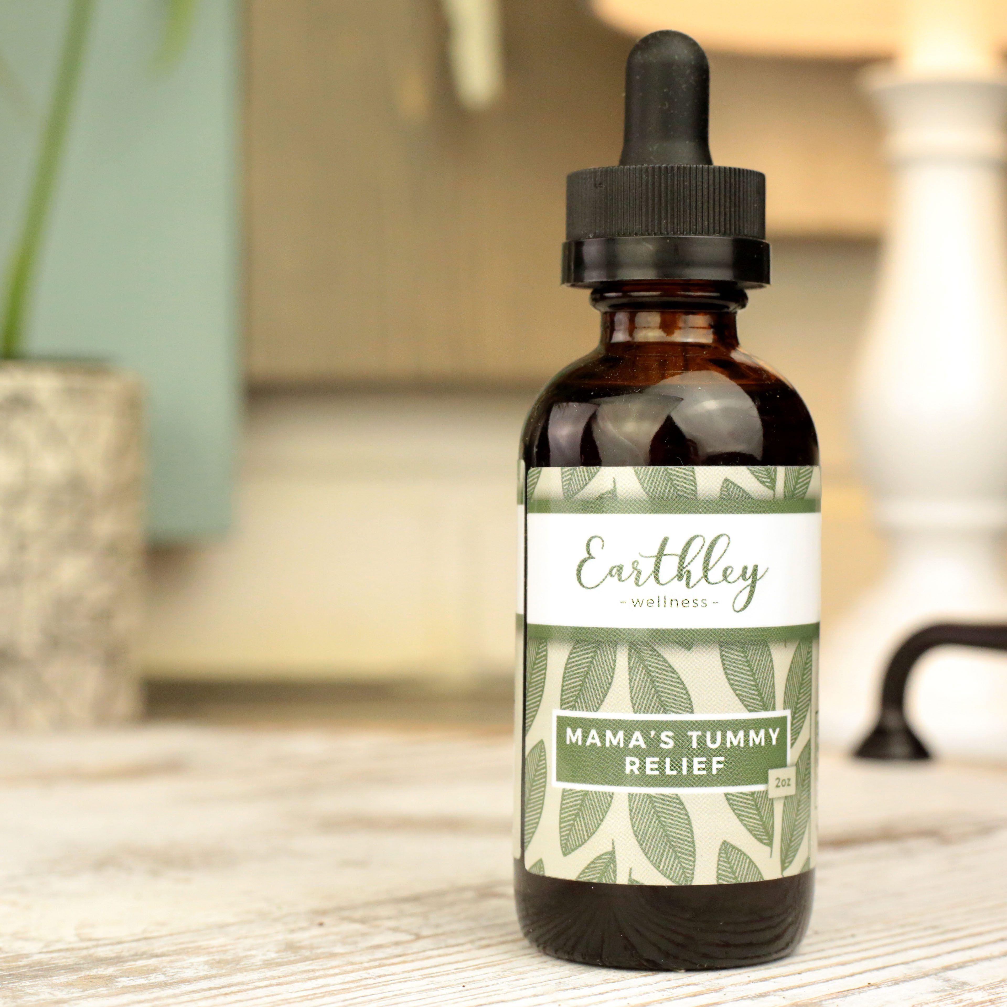 Earthley Mamas Tummy Relief herbal extract amber dropper bottle with pink floral label for pregnancy digestive support