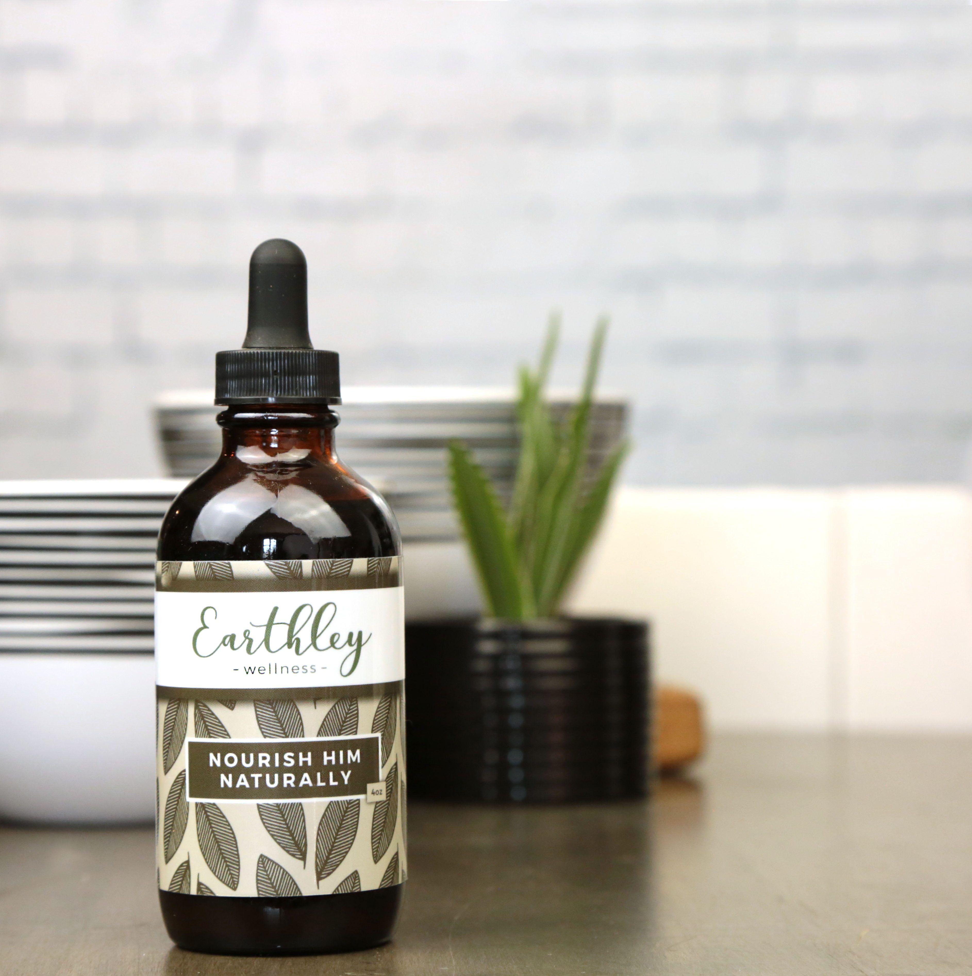 Earthley Nourish Him Naturally mens multivitamin amber bottle with green botanical label for male health support