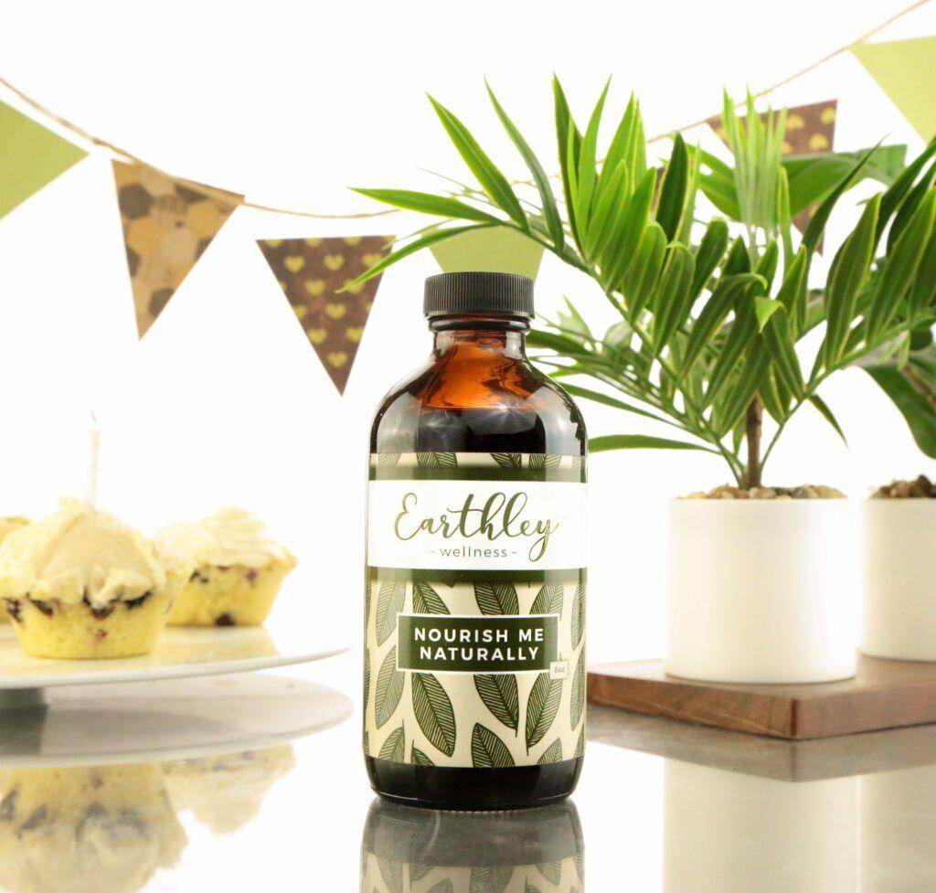 Nourish Me Naturally herbal extract in amber dropper bottle with green leaf label