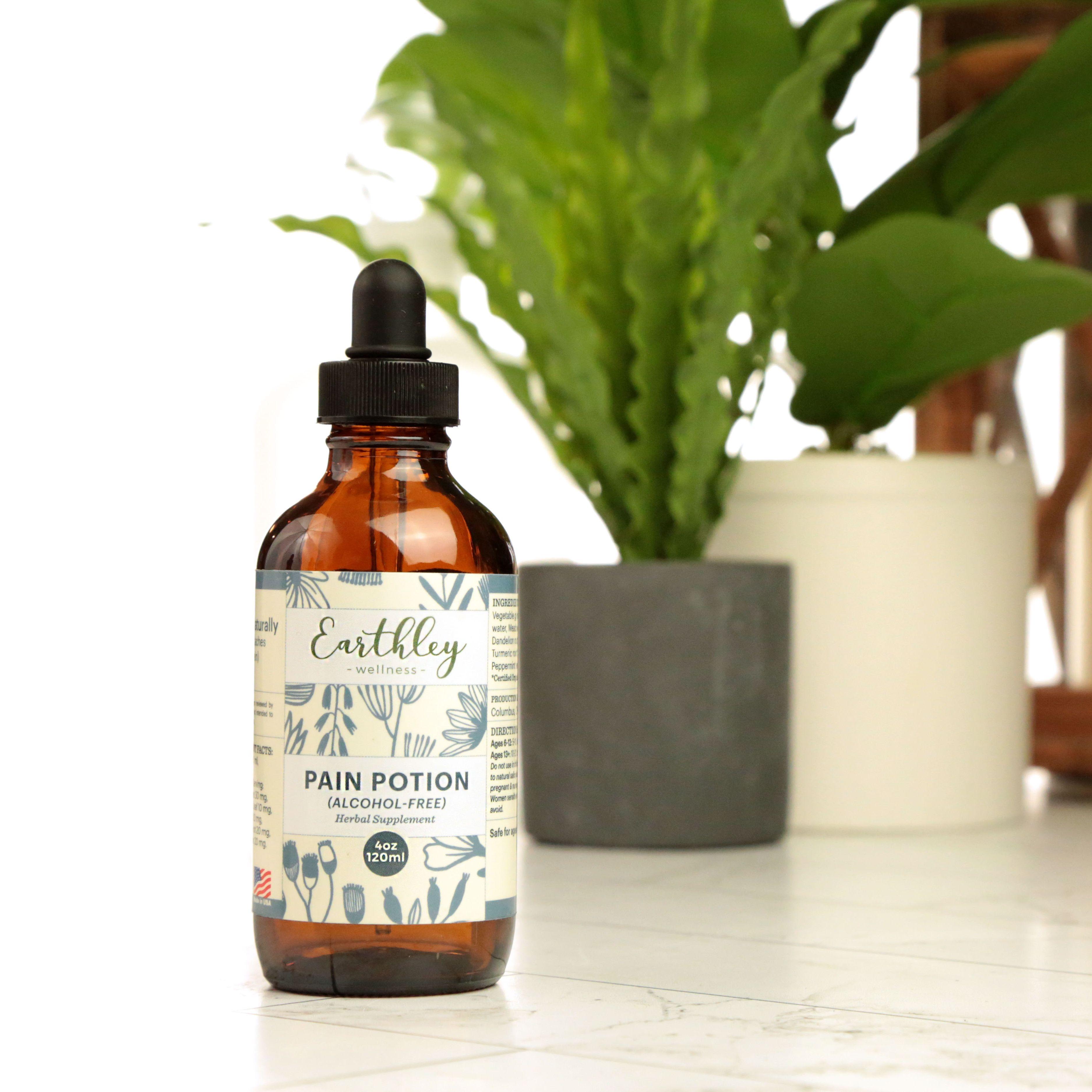 Earthley Pain Potion Alcohol-Free 4oz tincture bottle with blue botanical pattern label and green plant in background