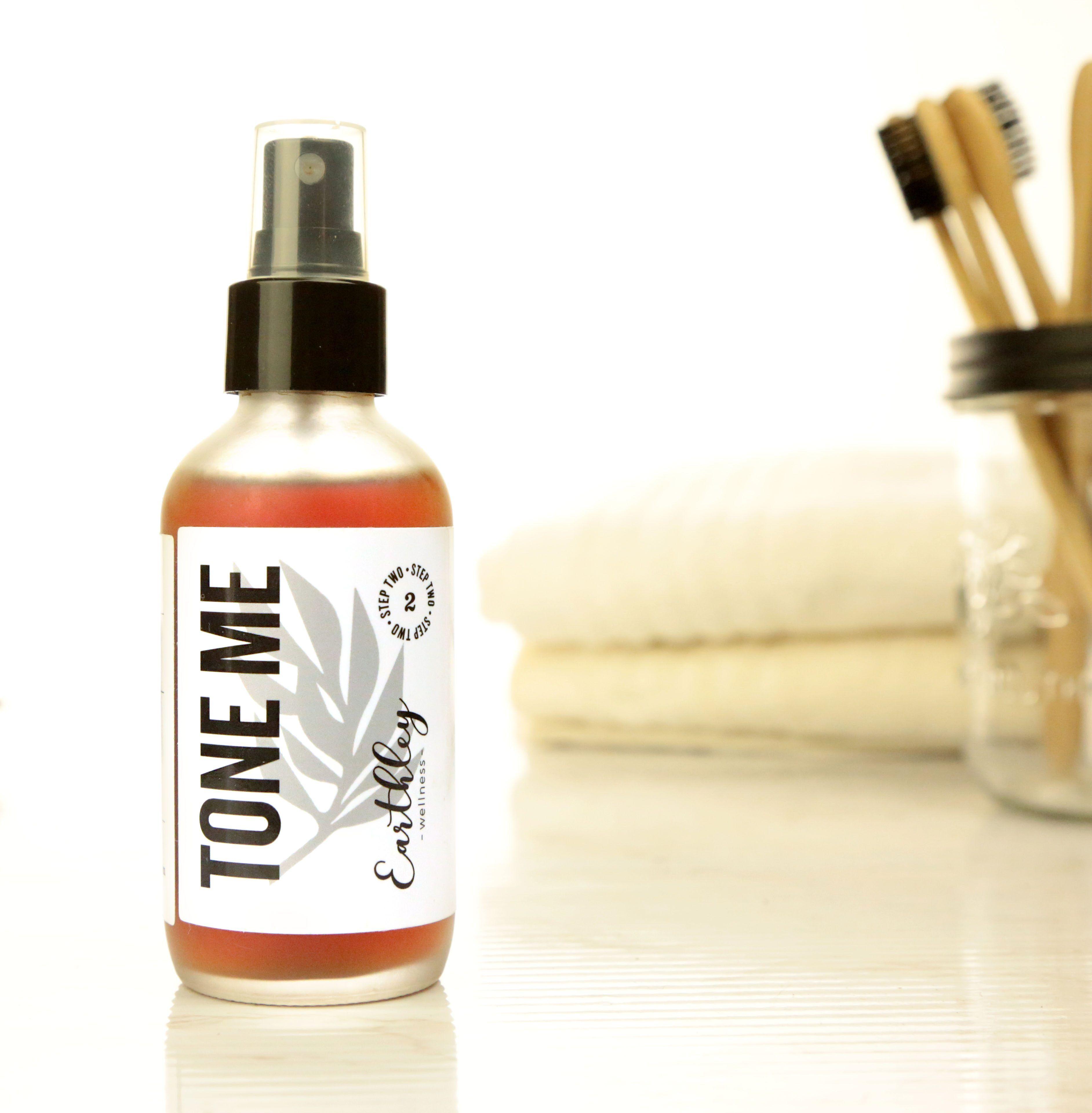 Tone Me facial toner spray in frosted bottle Step 2 skincare with bathroom setting