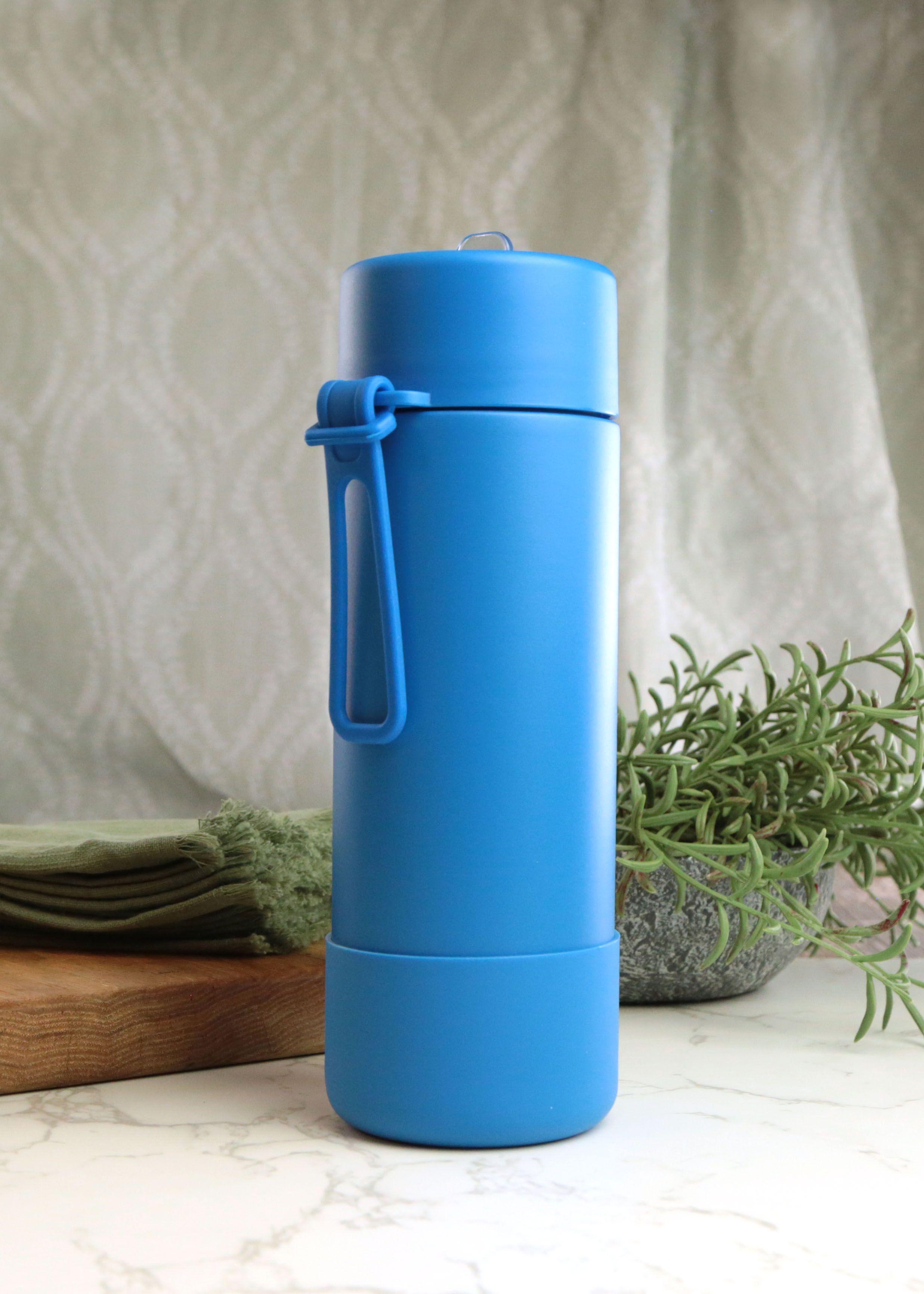 Earthley water bottle blue 831A1913 copy product displayed on clean background